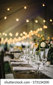 Wedding Table Setting With Bistro Lights. 