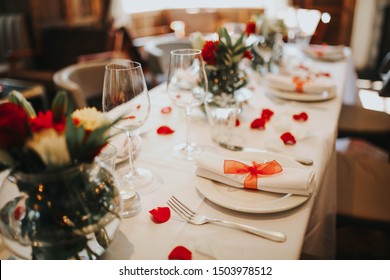 Wedding Table Setting Decorated With Fresh Flowers And Silverware. Concept Of Fine Dining, Catering And Exclusive Private Hire Of An Event Space. Banquet Table Set Up For A Wedding Reception Or Dinner