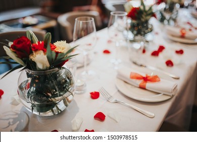 Wedding Table Setting Decorated With Fresh Flowers And Silverware. Concept Of Fine Dining, Catering And Exclusive Private Hire Of An Event Space. Banquet Table Set Up For A Wedding Reception Or Dinner