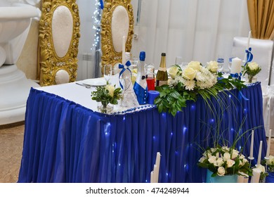 Wedding Table Setting In Restaurant: Nametags, Chairs, Wine Glass, Cutlery, Plates, Flowers And Decoration On Tables