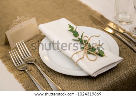 Wedding table setting in rustic style. Eco style. Wedding decoration. Table setting with a sign for the label