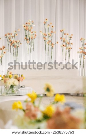 Wedding table and sofa setup with minimalist floral arrangement