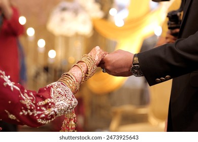 wedding theme, holding hands newlyweds, Picture of man and woman with wedding ring.Young married couple holding hands, ceremony wedding day. Newly wed couple's hands with wedding rings.
 - Powered by Shutterstock