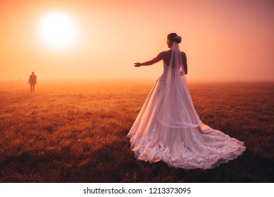 Wedding vivid photo. Bride take a hand to groom in autumn morning nature