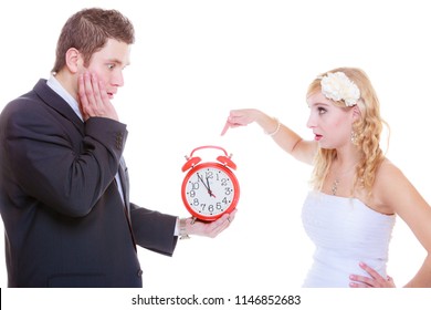 Wedding, Waiting For Celebration And Proposal, Negative Bad Relationship Concept. Groom Holding Bid Red Clock Yelling At His Birde Future Wife In White Dress.