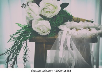 Wedding White Bridal Veil  Rose Flower Bouquet On Wooden Chair Beside See Through Sheer Window Curtain