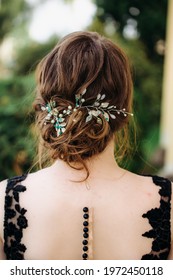 Wedding Woman's Hairdress Low Bun On Brown-haired Back View Close-up.