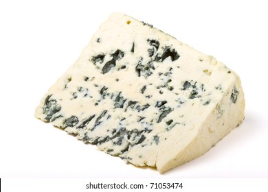 A wedge of full fat soft blue cheese isolated on white.