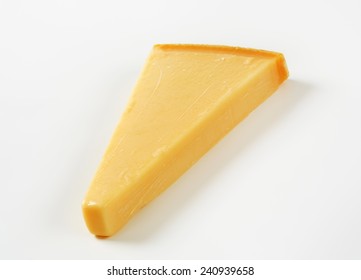 Wedge Of Parmesan Cheese On White Background