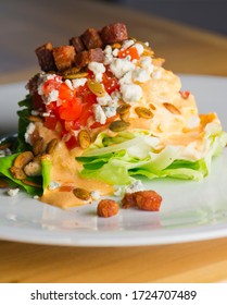 Wedge Salad. Classic American Salad With Iceberg Lettuce, Blue Cheese Dressing, Red Onions, Bacon Lardons, Parmesan Cheese, Olive Oil, Lemon Juice, Salt And Pepper. A Fine Dining Restaurant Classic.