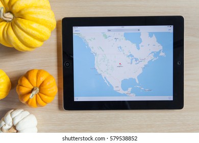 Wednesday 15 February 2017 : In Chiang Mai Thailand, Map App Running On  Ipad On Wooden Table On Top.