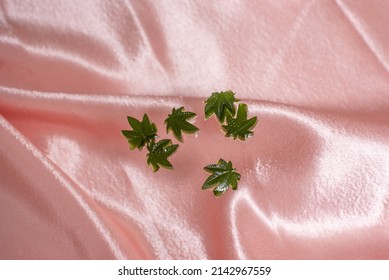 Weed Gummies On Pink Satin