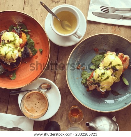 A weekend brunch of egg benedict served with coffee or tea, whichever suits.