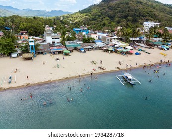 A Weekend Vacationers Crowd A Public Beach In Calayo, Nasugbu, Batangas, Philippines. Aerial Drone Shot. Local Tourism In The Philippines.