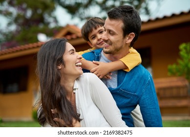 Weekends Dont Get Better Than This. Shot Of A Beautiful Young Family Spending Some Time Together Outdoors.