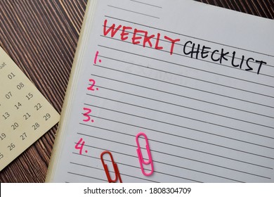 Weekly Checklist Write On A Book. Supported By An Additional Services Isolated On Wooden Table.