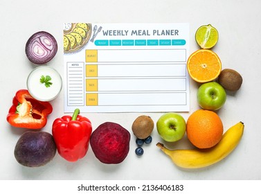 Weekly meal planner and different healthy products on light background - Powered by Shutterstock
