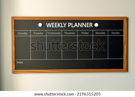 WEEKLY PLANNER. Magnetic board with the days of the week. Place to enter important matters. Concept for business.