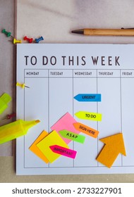 Weekly Planner with sticky notes and yellow marker