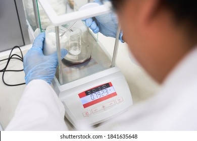 Weighing Of Raw Materials In  Chemical Laboratory, Laboratory Technician At Work