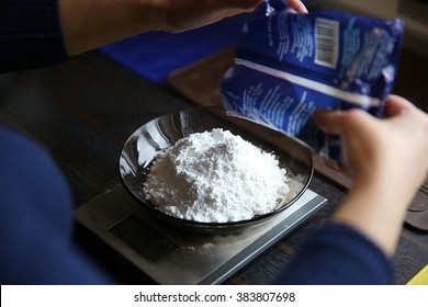 Weighing Sugar Powder On The Digital Scale