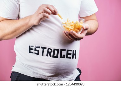 Weight Gain, Fast Food, Hormonal Imbalance, Estrogen Level. Overweight Man Belly With French Fries