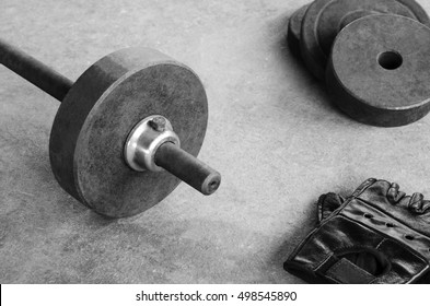 Weight iron barbell bar dumbbell on a sport gym