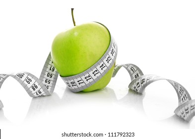 Weight Loss Concept. Apple And Measuring Tape On White Background. Diet.