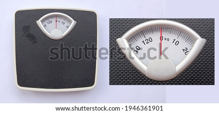 weight scale in black on white background dan the scale is zooming on the weight indicator. kilogram scales