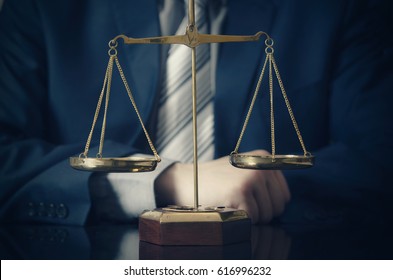 Weight Scale Of Justice, Lawyer In Background. Lawyer Law Justice Judge Scales Courtroom Legal Scale Concept