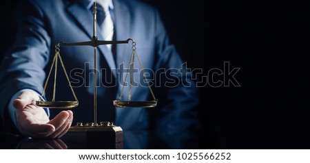 Weight scale of justice, lawyer in background. justice law lawyer attorney scale weight court authority concept