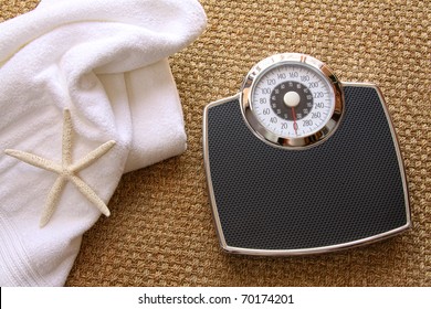 Weight Scale With White Towel On Seagrass Carpet