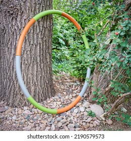 Weighted Hula Hoop In A Backyard In Summer Scenery, Core Workout Concept