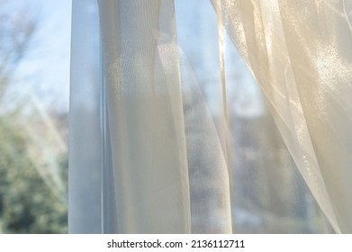 Weightless Beautiful Curtain On The Window Opening. Cream Tulle On The Window Opening