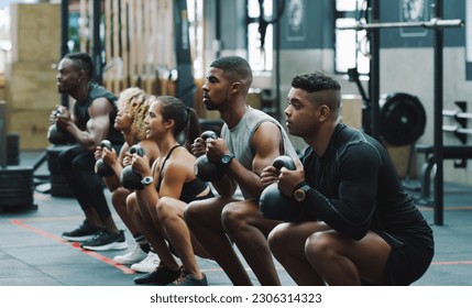 Weightlifting, fitness and people with kettle bell in gym for training, exercise and workout class. Teamwork, body builder and men and women squat with weights for challenge, wellness and strength - Powered by Shutterstock