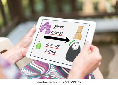 Weightloss concept shown on a tablet held by a woman - Shutterstock ID 538933459