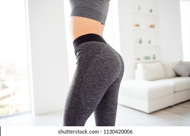 Weightloss wellness eating nutrition vitality concept. Cropped close up view photo of sexual sporty sportive tempting beautiful attractive nice round ass wearing gray tight pants leggings