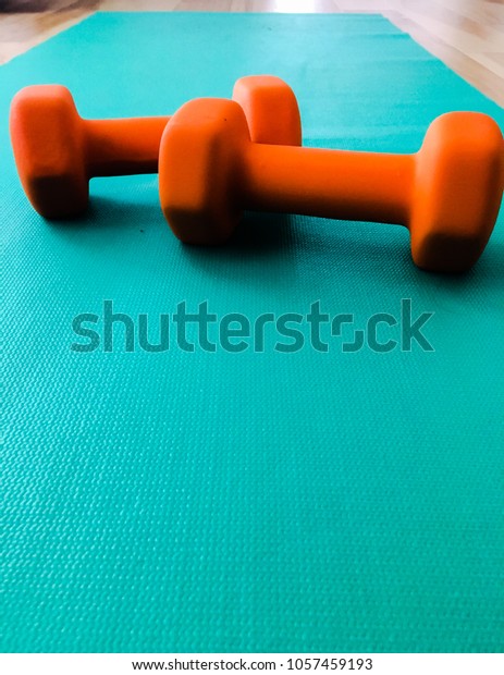 Weights On Yoga Mat Stock Photo Edit Now 1057459193