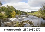 Weir on the Dales Way, River Wharfe at Linton Falls. Grassington, Wharfedale, Yorkshire Dales, UK