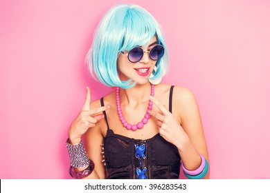 Weird And Funny Pop Girl Portrait Wearing Blue Wig