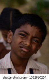 Weird Look Of A Kid Onto Yhe Camera.seems Like He Is Little Bit Dissapointed.