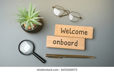 Welcome aboard concept. Friendly expression used to greet someone who is joining a team, company, group, or journey (like a trip or flight). It shows inclusion and a warm reception. Wooden blocks