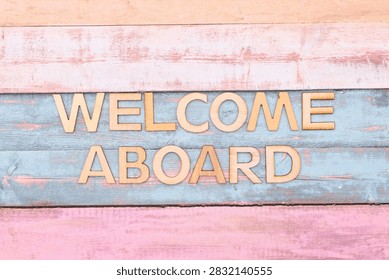 welcome aboard write on rustical wooden background 