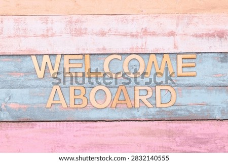 welcome aboard write on rustical wooden background 