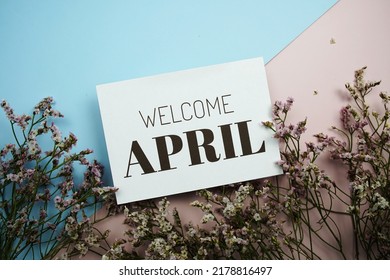 Welcome April Text Message With Flower On Blue And Pink Background