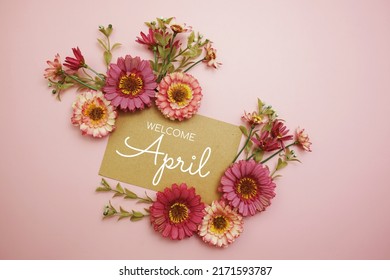 Welcome April Typography Text With Flowers On Pink Background