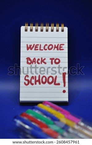 welcome back to school write between school supplies 