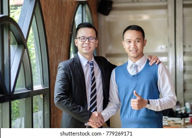 Welcome to board! Asian business people shaking hands with new partner meeting time after agree join new start up project,business colleagues teamwork concept isolate background - Shutterstock ID 779269171
