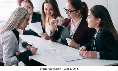 Welcome to business team. Successful job interview. Young female signing corporate contract. - Shutterstock ID 1325870945