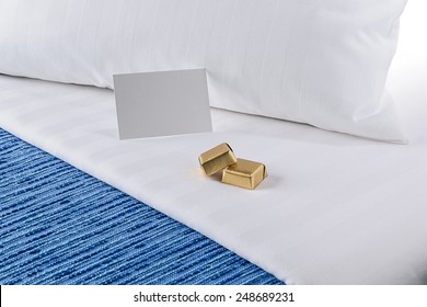 Welcome Chocolates On The Hotel Bed-horizontal